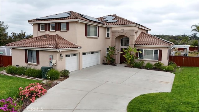 1732 Gamble Ln, Escondido, CA 92029 - mediterranean / spanish house featuring a tile roof, roof mounted solar panels, stucco siding, an attached garage, and concrete driveway
