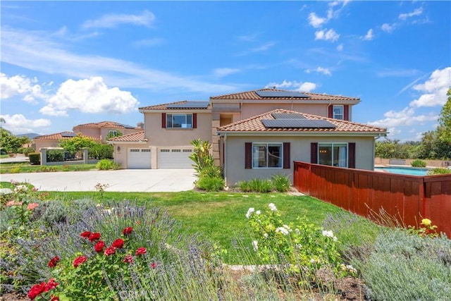 1732 Gamble Ln, Escondido, CA 92029 - mediterranean / spanish house with stucco siding, concrete driveway, solar panels, an attached garage, and a tiled roof