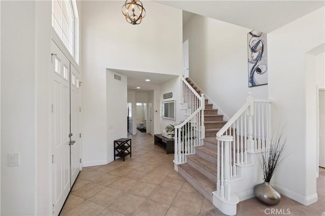 1732 Gamble Ln, Escondido, CA 92029 - foyer entrance featuring stairs, a towering ceiling, light tile patterned flooring, and a chandelier