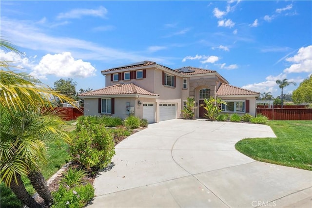 1732 Gamble Ln, Escondido, CA 92029 - mediterranean / spanish house featuring stucco siding, solar panels, an attached garage, a tile roof, and concrete driveway