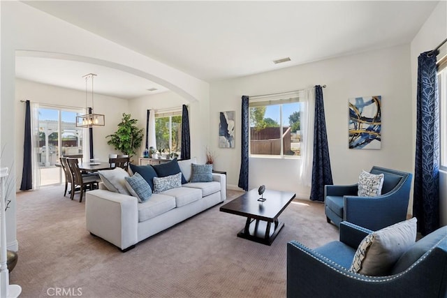 1732 Gamble Ln, Escondido, CA 92029 - living area featuring arched walkways, carpet, and plenty of natural light