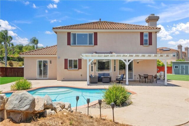 1732 Gamble Ln, Escondido, CA 92029 - rear view of property featuring an outdoor hangout area, a pergola, a storage shed, a tiled roof, and a patio