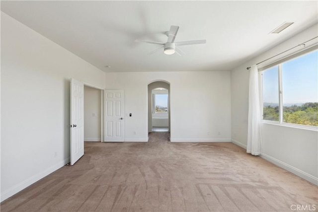1732 Gamble Ln, Escondido, CA 92029 - empty room with arched walkways, a ceiling fan, and carpet