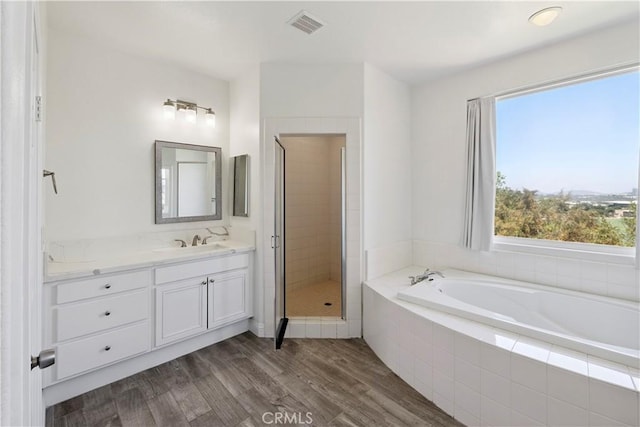 1732 Gamble Ln, Escondido, CA 92029 - bathroom featuring a bath, vanity, a shower stall, and wood finished floors