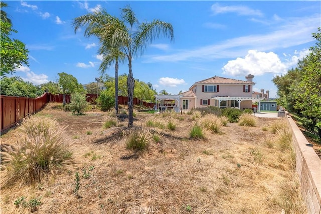 1732 Gamble Ln, Escondido, CA 92029 - back of property with a pergola, stucco siding, a tile roof, and a chimney