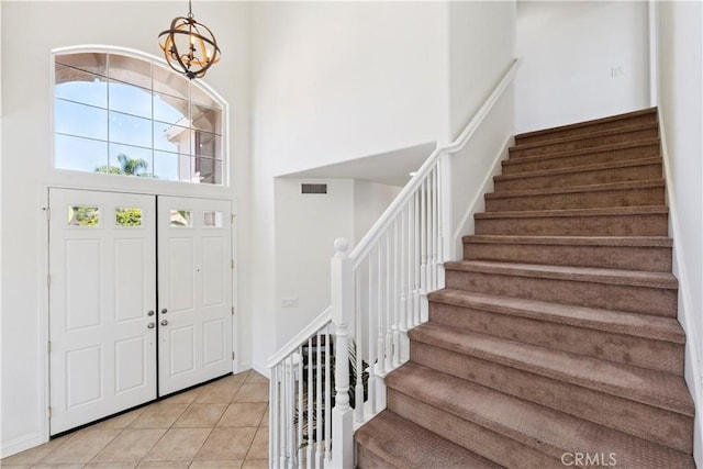 1732 Gamble Ln, Escondido, CA 92029 - foyer with a high ceiling, stairway, a chandelier, and light tile patterned floors