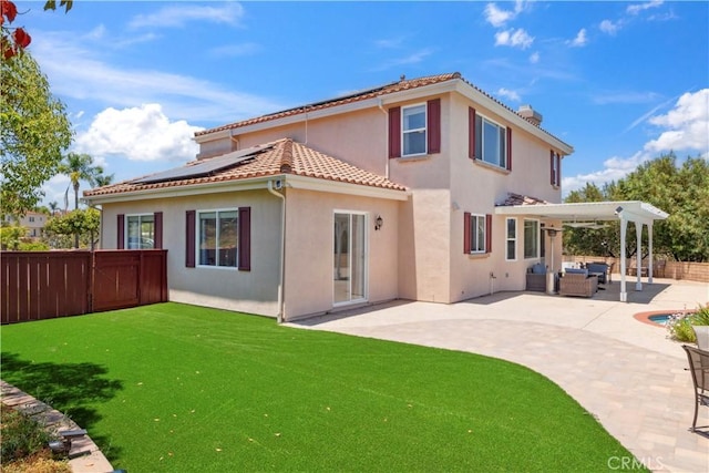 1732 Gamble Ln, Escondido, CA 92029 - back of house with outdoor lounge area, solar panels, a fenced backyard, a patio area, and stucco siding