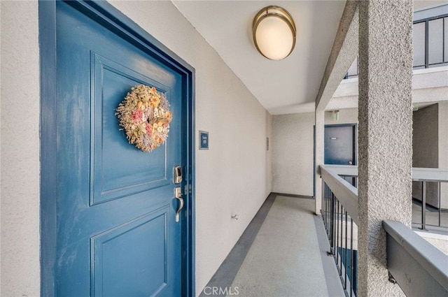 property entrance featuring stucco siding