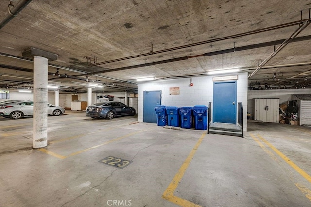 parking deck featuring concrete block wall