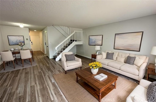 1920 S Mcclelland St Unit 27A, Santa Maria, CA 93454 - living area with stairway, wood finished floors, and baseboards
