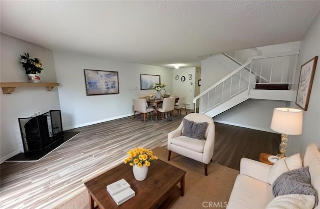 1920 S Mcclelland St Unit 27A, Santa Maria, CA 93454 - living room featuring stairway, wood finished floors, and baseboards