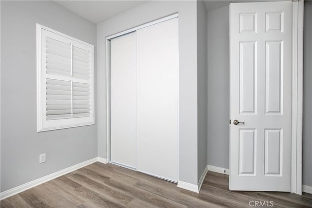 6335 Oldfield St, Lancaster, CA 93536 - unfurnished bedroom featuring wood finished floors and a closet