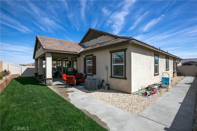 6335 Oldfield St, Lancaster, CA 93536 - view of side of home with a patio area, a fenced backyard, and stucco siding