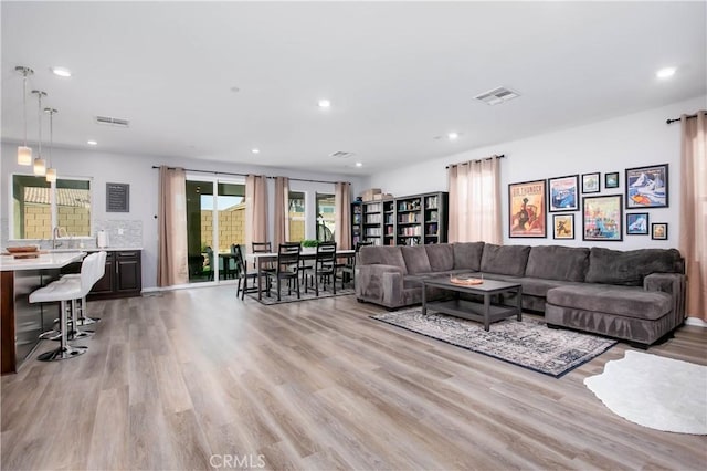 6335 Oldfield St, Lancaster, CA 93536 - living room featuring light wood-style floors and recessed lighting