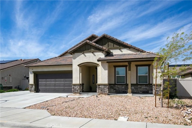 6335 Oldfield St, Lancaster, CA 93536 - view of front of home featuring stone siding, driveway, an attached garage, and stucco siding