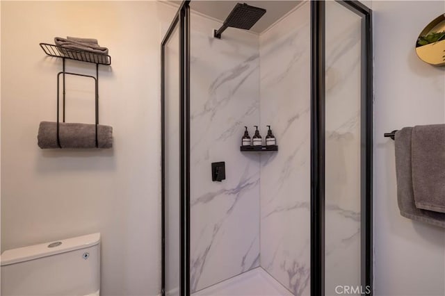 full bath with toilet and a marble finish shower