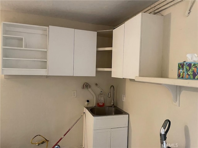 8772 Mignonette St, Rancho Cucamonga, CA 91701 - laundry area with washer hookup and cabinet space