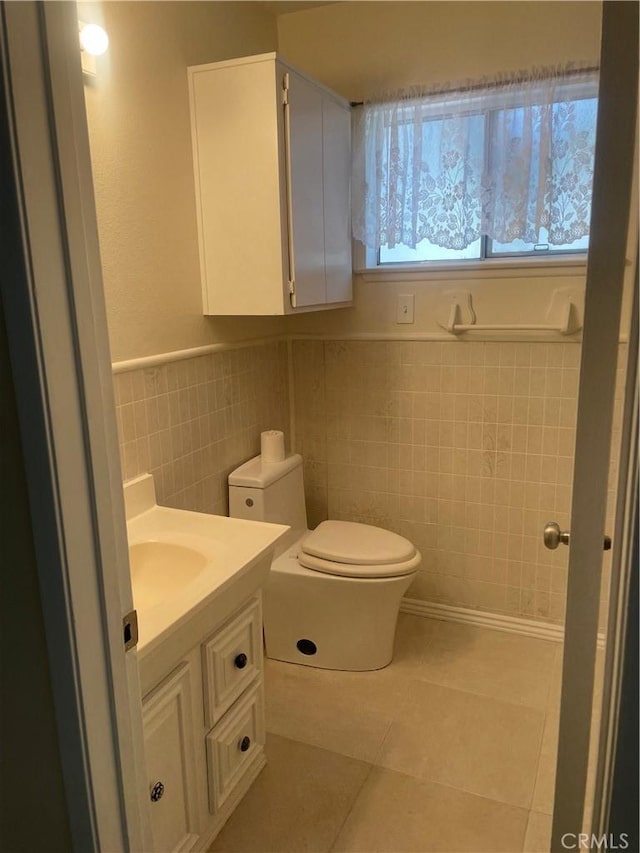 8772 Mignonette St, Rancho Cucamonga, CA 91701 - bathroom featuring tile walls, tile patterned flooring, vanity, toilet, and wainscoting