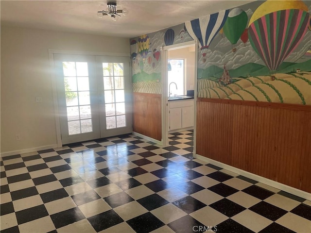 8772 Mignonette St, Rancho Cucamonga, CA 91701 - unfurnished dining area featuring french doors, tile patterned floors, a sink, baseboards, and wallpapered walls