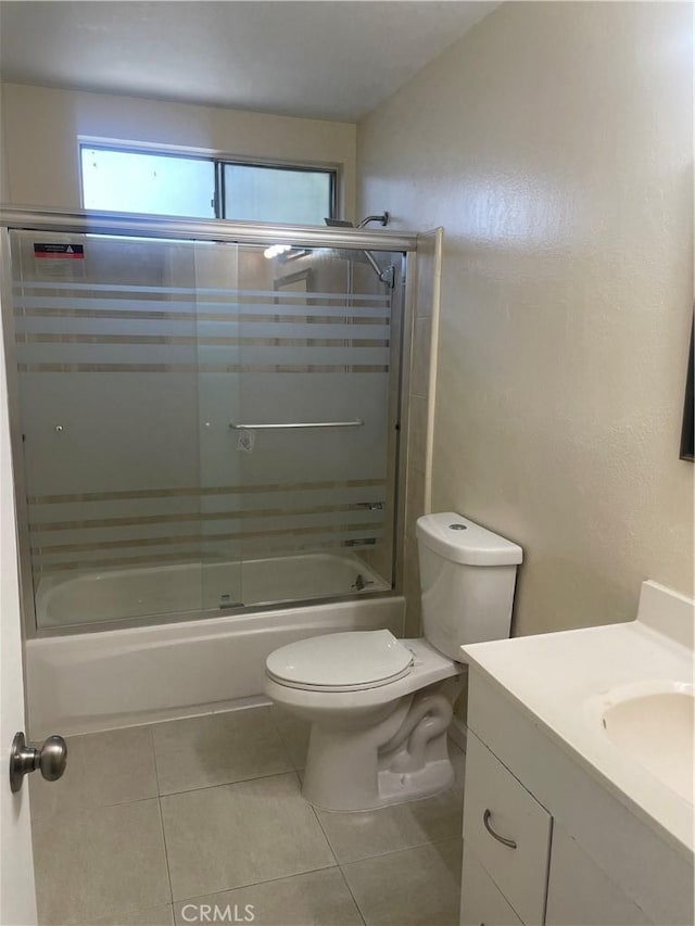 8772 Mignonette St, Rancho Cucamonga, CA 91701 - bathroom with vanity, toilet, bath / shower combo with glass door, tile patterned flooring, and a textured wall