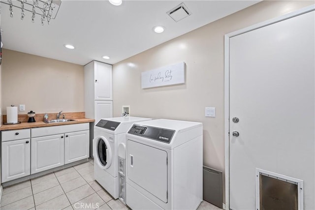28863 Capano Bay Ct, Menifee, CA 92584 - laundry room featuring washing machine and clothes dryer, light tile patterned flooring, cabinet space, and recessed lighting