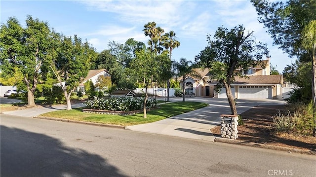 28863 Capano Bay Ct, Menifee, CA 92584 - view of property hidden behind natural elements with driveway and a garage