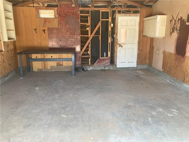 interior space featuring wood walls