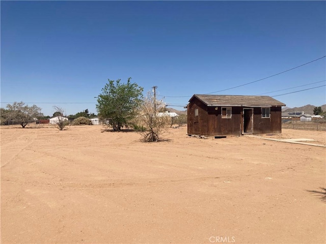 view of yard with an outbuilding and a storage unit