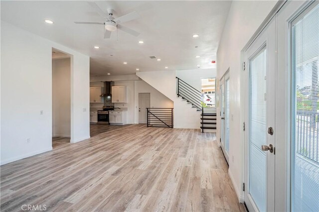 29847 Smugglers Point Dr, Canyon Lake, CA 92587 - unfurnished living room featuring light wood-style floors, stairs, recessed lighting, and a ceiling fan