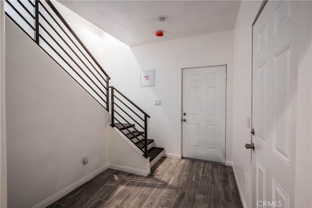 29847 Smugglers Point Dr, Canyon Lake, CA 92587 - entryway with dark wood-type flooring and stairway