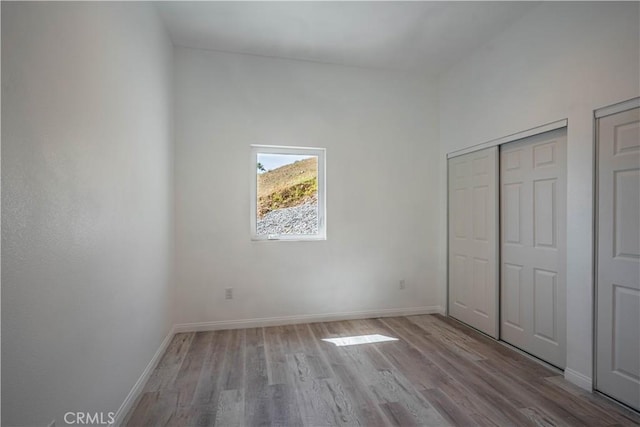 29847 Smugglers Point Dr, Canyon Lake, CA 92587 - unfurnished bedroom with wood finished floors and baseboards