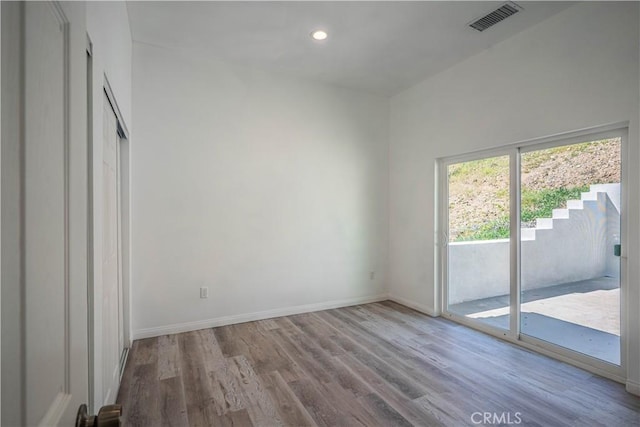29847 Smugglers Point Dr, Canyon Lake, CA 92587 - unfurnished bedroom featuring access to exterior, wood finished floors, and recessed lighting