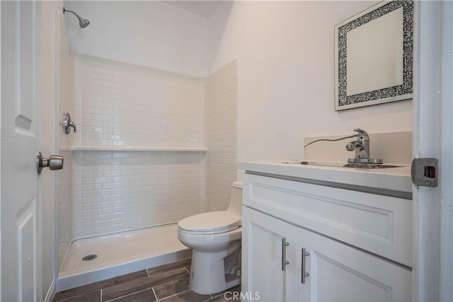 29847 Smugglers Point Dr, Canyon Lake, CA 92587 - bathroom featuring vanity, a tile shower, and wood finish floors