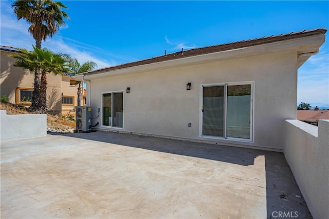 29847 Smugglers Point Dr, Canyon Lake, CA 92587 - rear view of house with stucco siding and a patio