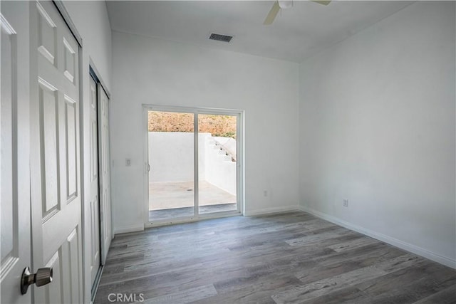 29847 Smugglers Point Dr, Canyon Lake, CA 92587 - unfurnished bedroom with access to exterior, wood finished floors, and ceiling fan