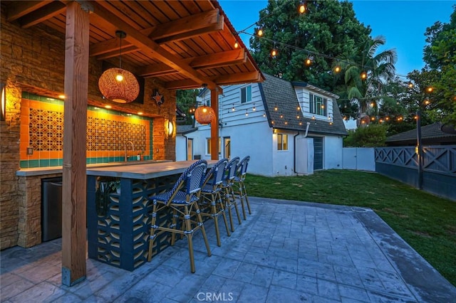 view of patio / terrace featuring a fenced backyard and outdoor dry bar
