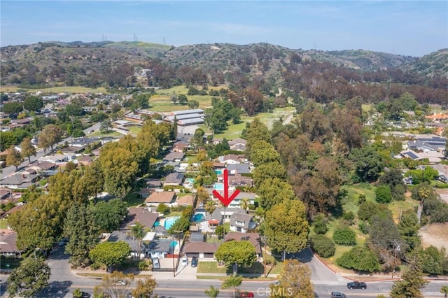 drone / aerial view featuring a residential view and a mountain view