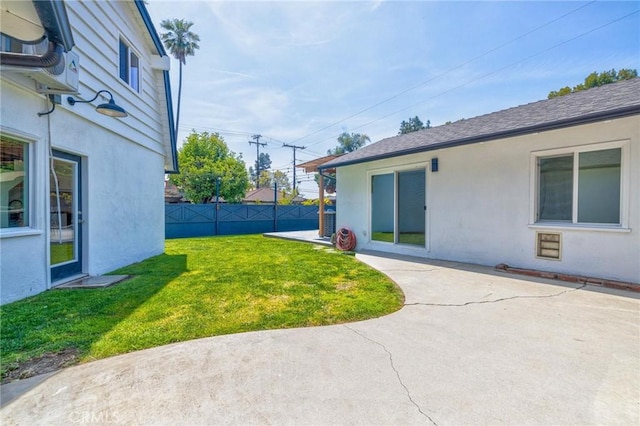 view of yard featuring a patio and fence