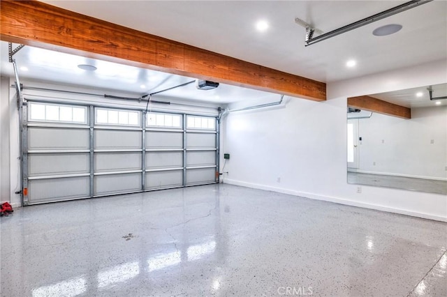 garage with recessed lighting, baseboards, and a garage door opener