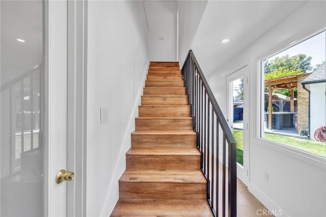 staircase featuring recessed lighting and baseboards