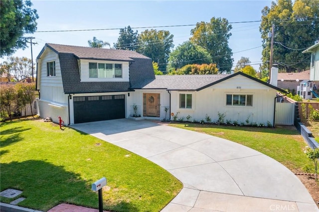 view of front of property featuring a front lawn, driveway, an attached garage, a gambrel roof, and a shingled roof