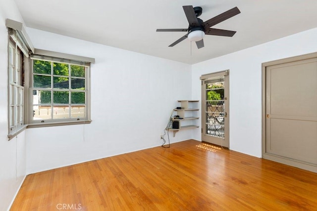 empty room featuring wood finished floors and ceiling fan
