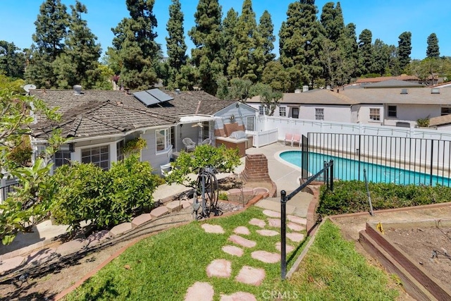 view of swimming pool featuring a fenced in pool, a patio, and a fenced backyard