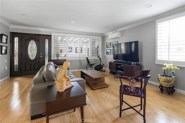 114 Via Estrada Unit B, Laguna Woods, CA 92637 - living room with light wood-style floors, plenty of natural light, and a wall unit AC