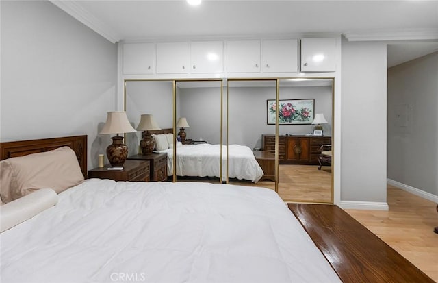 114 Via Estrada Unit B, Laguna Woods, CA 92637 - bedroom featuring wood finished floors, a closet, baseboards, and ornamental molding