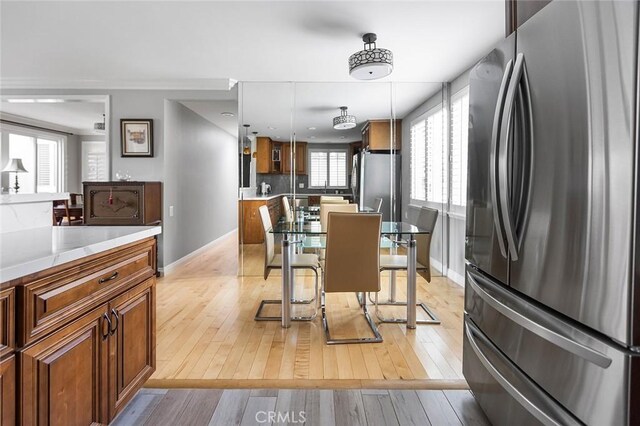 114 Via Estrada Unit B, Laguna Woods, CA 92637 - dining space featuring light wood-type flooring and baseboards