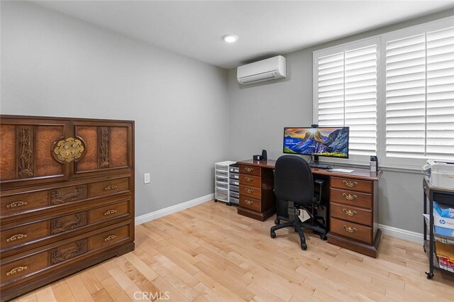 114 Via Estrada Unit B, Laguna Woods, CA 92637 - home office with light wood finished floors, baseboards, and a wall mounted air conditioner