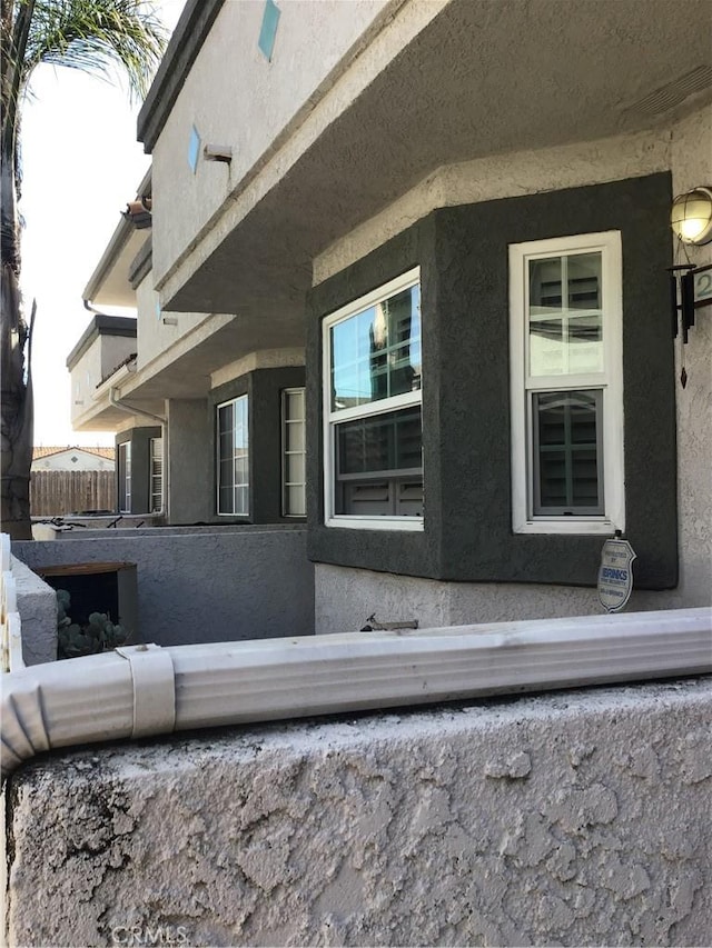 13919 Arthur Ave Unit 22, Paramount, CA 90723 - view of side of home featuring a balcony and stucco siding