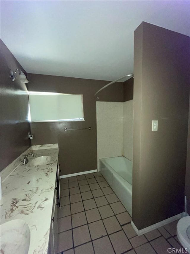 full bath featuring tile patterned flooring, toilet, vanity, baseboards, and shower / bathing tub combination