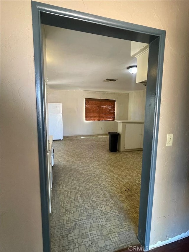 hall featuring visible vents